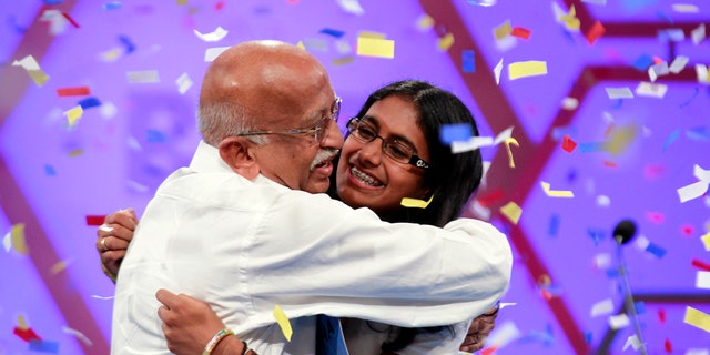 May 31, 2012: Snigdha Nandipati, 14, of San Diego, reacts with her grandfather from India, after winning the National Spelling Bee in Oxon Hill, Md.