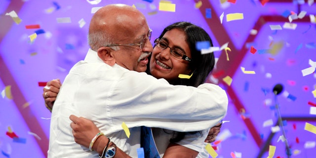 May 31, 2012: Snigdha Nandipati, 14, of San Diego, reacts with her grandfather from India, after winning the National Spelling Bee in Oxon Hill, Md.