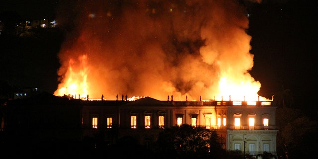 Flames tearing through the 200-year-old National Museum of Brazil in Rio de Janeiro on Sunday.