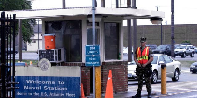 Security personnel at Norfolk Naval Station in Norfolk, Va., in 2004.