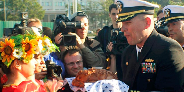 FILE 2012: Cmdr. Joseph R. Darlak, right foreground, was relieved of command in San Diego after an investigation for demonstrating poor leadership and failing to ensure proper officer conduct during the three-day September stop.