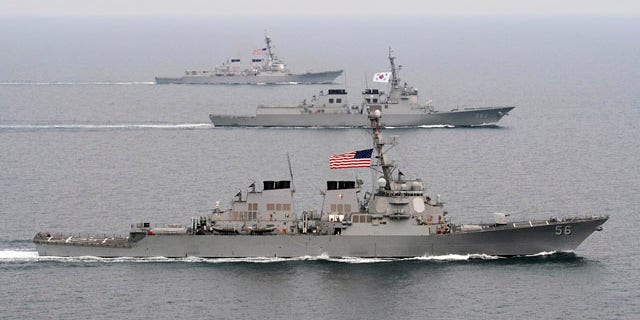 March 17, 2013: The Arleigh Burke-class guided-missile destroyer USS John S. McCain (DDG 56), foreground, the Republic of Korea Navy Aegis-class destroyer ROKS Seoae-Yu-Seong-Ryong (DDG 993), center, and the Arleigh Burke-class guided-missile destroyer USS McCampbell (DDG 85) move into formation during exercise Foal Eagle 2013 in the West Sea in South Korea.