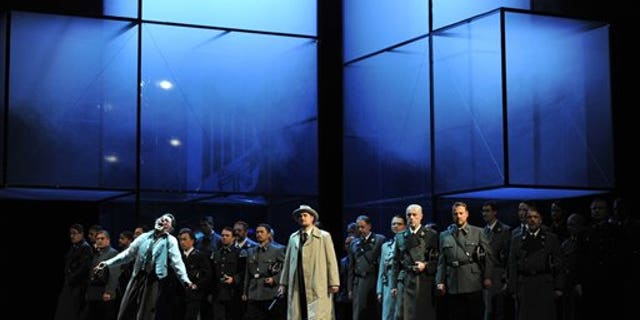 The photo provided by Deutsche Oper am Rhein in Duesseldorf, western Germany, shows Markus Eiche, left, as Wolfram and Thorsten Gruembel as Landgraf performing in front of the choir in a scene of the the opera "Tannhaeuser" during the dress rehearsal on April 30, 2013.