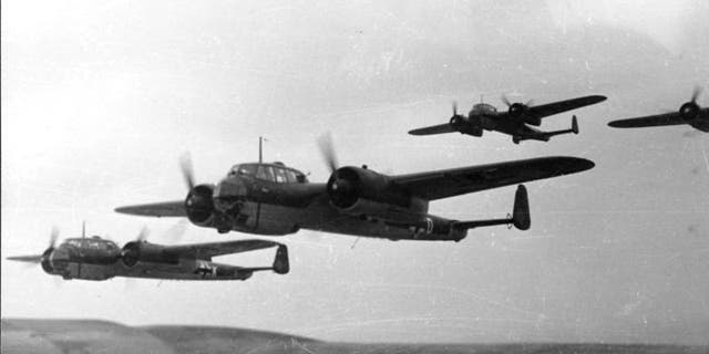 A formation of Dornier Do 17 planes flies in 1940.