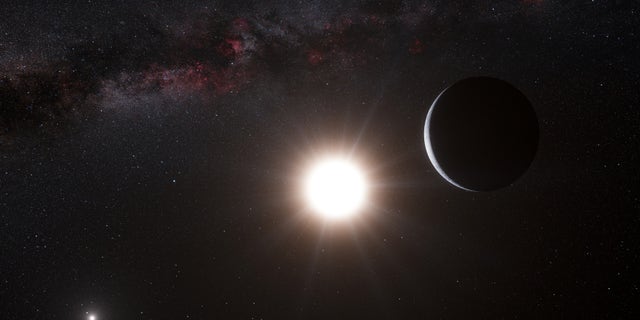 Oct. 16, 2012: This artists impression made available by the European Southern Observatory shows a planet, right, orbiting the star Alpha Centauri B, center, a member of the triple star system that is the closest to Earth. Alpha Centauri A is at left. The Earth's Sun is visible at upper right.