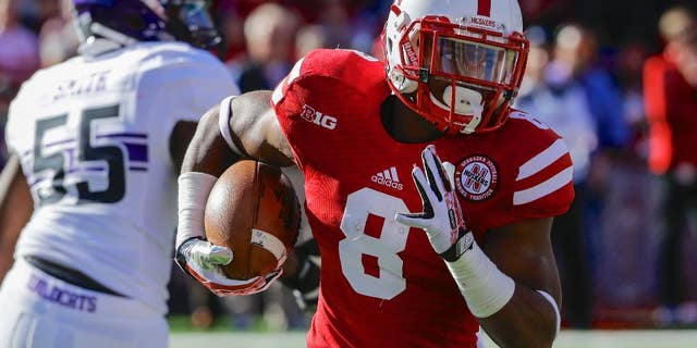 FILE - In this Nov. 2, 2013, file photo, Nebraska running back Ameer Abdullah (8) runs with the ball in the first half of an NCAA college football game against Northwestern in Lincoln, Neb. At a school that has a tradition of producing great running backs, Nebraska's Abdullah already is one of the greatest. (AP Photo/Nati Harnik, FIle)