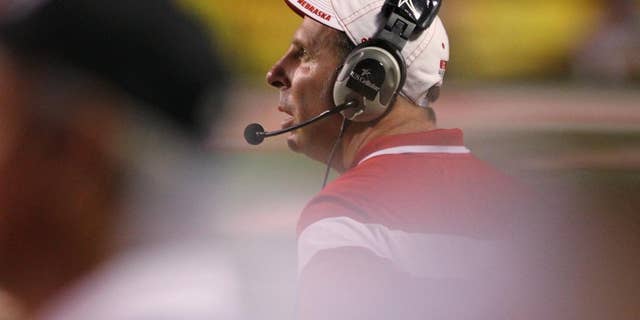 Nebraska's Bo Pelini checks the scoreboard against Fresno State in the second half of an NCAA college football game in Fresno, Calif., Saturday, Sept. 13, 2014. (AP Photo/Gary Kazanjian)