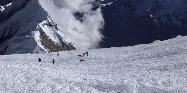 Sept. 23, 2012: In this picture released by Alpine Ascents International, rescuers search for survivors and victims in the debris field of an avalanche on Mount Manaslu in northern Nepal.
