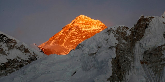 In this Nov. 12, 2015 file photo, Mt. Everest is seen from the way to Kalapatthar in Nepal. Climbers are making good progress on Mount Everest and the first group could reach the summit as early as Thursday, following two years of disasters on the world's highest mountain, a mountaineering official said Tuesday. Nearly 300 foreign climbers and their guides are attempting to reach the 8,850-meter (29,035-foot) summit. (AP Photo/Tashi Sherpa, file)