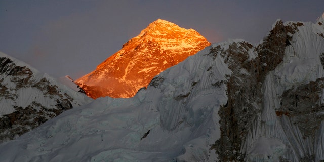 In this Nov. 12, 2015 file photo, Mt. Everest is seen from the way to Kalapatthar in Nepal. Climbers are making good progress on Mount Everest and the first group could reach the summit as early as Thursday, following two years of disasters on the world's highest mountain, a mountaineering official said Tuesday. Nearly 300 foreign climbers and their guides are attempting to reach the 8,850-meter (29,035-foot) summit. (AP Photo/Tashi Sherpa, file)