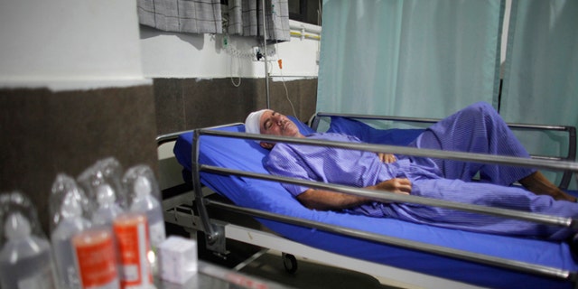 Spanish trekker Juan Mari Eguillor, 68, who survived a landslide receives treatment at Vayodha Hospital in Kathmandu, Nepal, Thursday, Sept. 22, 2016. A Spanish trekker and three Nepalese guides were killed Thursday and more than a dozen injured when they were hit by a landslide triggered by heavy rain in Nepal's northern mountains, officials said.(AP Photo/Niranjan Shrestha)