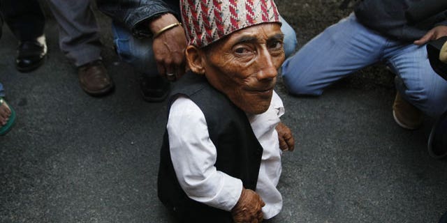 Feb. 22, 2012: Nepalese Chandra Bahadur Dangi, 72, who says he's only 22 inches (56 centimeters) tall arrives at the airport in Katmandu, Nepal.