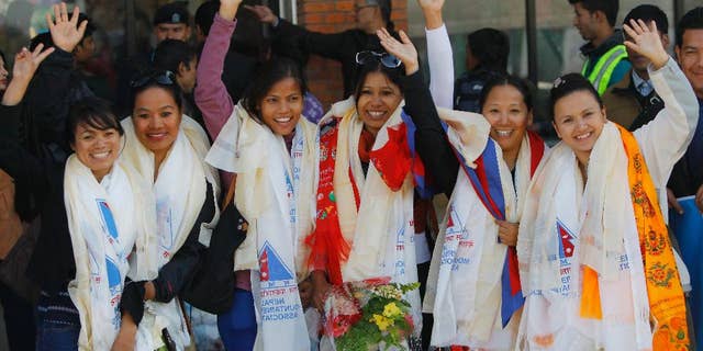 Jan. 9, 2015: From left to right: Nepalese climbers Nimdoma Sherpa, Maya Gurung, Asha Singh, Chunu Shrestha, Pema Dikki and Shailee Basnet pose for the media at the Tribhuwan International Airport, Kathmandu.