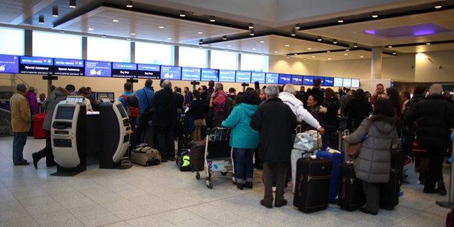 Delayed British Airways passengers wait in line at the check-in desk at Gatwick Airport's North Terminal on January 18, 2013 in London, United Kingdom.  (Photo by Jordan Mansfield/Getty Images)