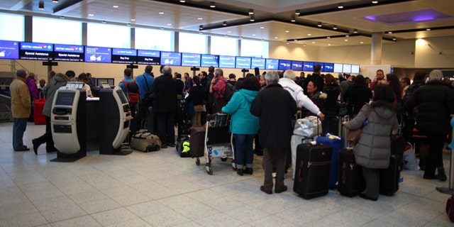 Delayed British Airways passengers wait in line at the check-in desk at Gatwick Airport's North Terminal on January 18, 2013 in London, United Kingdom. (Photo by Jordan Mansfield/Getty Images)