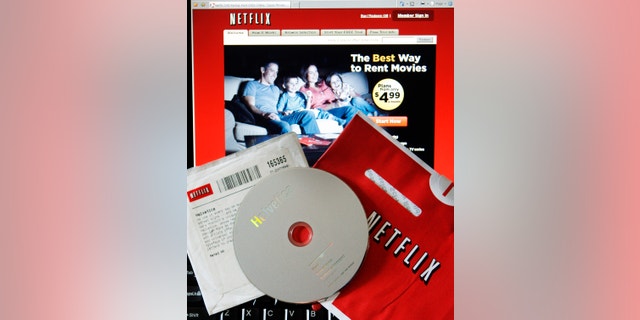 A DVD rental from Netflix is seen with the company's website.