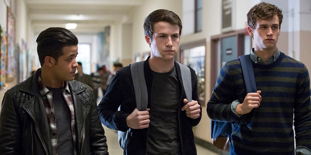 This image released by Netflix shows, from left, Christian Navarro, Dylan Minnette and Brandon Flynn in "13 Reasons Why."