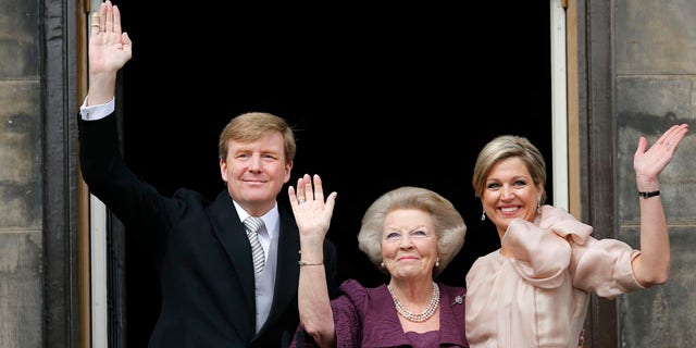 April 30, 2013: Dutch King Willem-Alexander, Queen Maxima, right, and Princess Beatrix appear on the balcony of the Royal Palace in Amsterdam, The Netherlands.