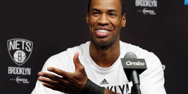 Brooklyn Nets Jason Collins speaks during a news conference before an NBA basketball game against the Chicago Bulls at the Barclays Center, Monday, March 3, 2014, in New York. More than a week after becoming the league's first openly gay player, Collins will finally get to play a home game. (AP Photo/Seth Wenig)