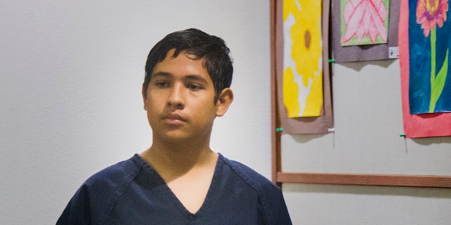 Adrian Navarro-Canales, 16, appears in Henderson Justice Court, in Henderson, Nev. Monday, Sept. 30, 2013,  on charges that he killed his mother and younger brother a day after celebrating his 16th birthday. Navarro-Canales is being prosecuted as an adult in the case.  (AP Photo/Las Vegas Review-Journal, Jeff Scheid)