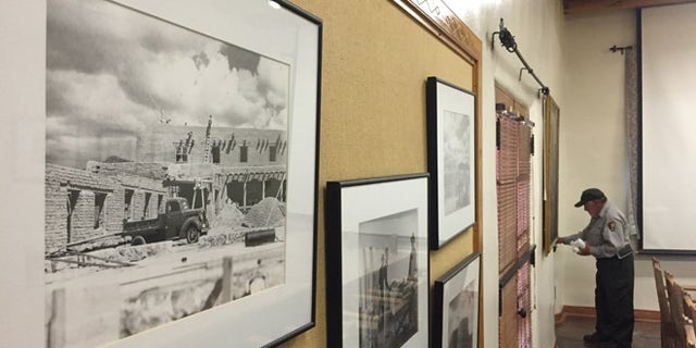 A custodian works at the National Park Service administration building, nicknamed the 'Old Santa Fe Trail Building.'