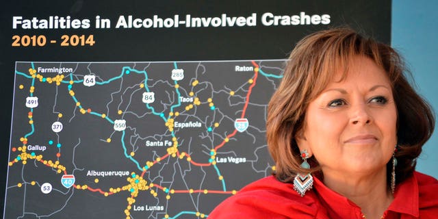New Mexico Gov. Susana Martinez stands in front of a state map of drunken-driving deaths during a news conference in Albuquerque, N.M. on Monday, Dec. 7, 2015. A recording from a Santa Fe police sergeant's belt tape suggests  Martinez was inebriated the night police responded to a complaint at a downtown hotel where the governor was hosting a holiday party. Santa Fe Police released the recording, Tuesday, Dec. 22, 2015, shedding more light on the Dec. 13 incident at the Eldorado Hotel and Spa. A clerk initially called dispatchers to report noise and that someone was throwing bottles from a hotel balcony. (AP Photo/Russell Contreras, File)