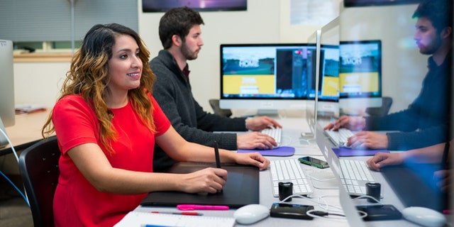 In this November 2015 photo provided by Western New Mexico University shows student Grecia Rivas works in a computer lab on campus in Silver City, N.M. The school in recent months have launched an aggressive campaign aimed at attracting students like Rivas, high-achieving immigrants living in the country illegally but who have been granted temporary status under the Obama Administration. (Jay Hemphill/Western New Mexico University via AP)