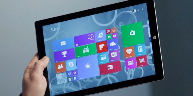 Panos Panay, Microsoft's vice president for surface computing, introduces the Surface Pro 3 tablet device at a media preview, Tuesday, May 20, 2014 in New York. The device will have a screen measuring 12 inches diagonally, up from 10.6 inches in previous models. Microsoft says it's also thinner and faster than before. (AP Photo/Mark Lennihan)