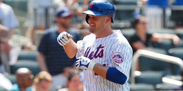 NEW YORK, NY - MAY 27: Lucas Duda #21 of the New York Mets smiles after hitting his second home run of the game in the fifth inning against the Philadelphia Phillies at Citi Field on May 27, 2015 in Flushing neighborhood of the Queens borough of New York City. (Photo by Mike Stobe/Getty Images)