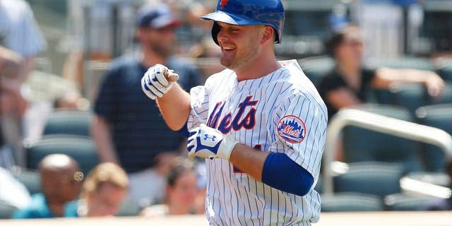 NEW YORK, NY - MAY 27: Lucas Duda #21 of the New York Mets smiles after hitting his second home run of the game in the fifth inning against the Philadelphia Phillies at Citi Field on May 27, 2015 in Flushing neighborhood of the Queens borough of New York City. (Photo by Mike Stobe/Getty Images)