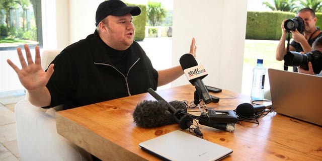 Jan. 20, 2013: Indicted Megaupload founder Kim Dotcom holds a press conference ahead of the launch of a new file-sharing website called "Mega" at his Coatesville mansion in Auckland, New Zealand.