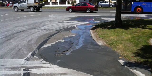 December 23, 2011: Liquefaction is seen seeping out of the ground after a 5.8-magnitude quake struck 16 miles north of Christchurch, New Zealand.