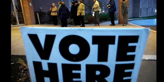 Nov. 6, 2012: Voters wait in line for the doors to Precinct 39 to open before casting their ballots on Election Day.
