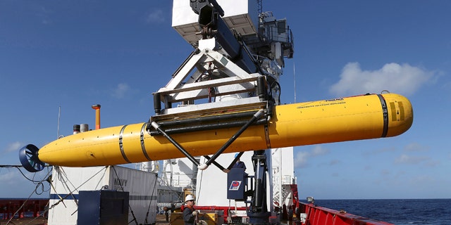 April 17, 2014: In this photo provided by the Australian Defense Force, the Phoenix International Autonomous Underwater Vehicle (AUV) Artemis is craned over the side of Australian Defense Vessel Ocean Shield before launching the vehicle into the southern Indian Ocean in the search of the missing Malaysia Airlines Flight 370. (AP Photo/Australian Defense Force, Bradley Darvill)