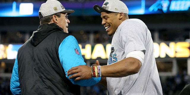 CHARLOTTE, NC - JANUARY 24: Head coach Ron Rivera of the Carolina Panthers celebrates with Cam Newton #1 after defeating the Arizona Cardinals with a score of 49 to 15 to win the NFC Championship Game at Bank of America Stadium on January 24, 2016 in Charlotte, North Carolina. (Photo by Streeter Lecka/Getty Images)
