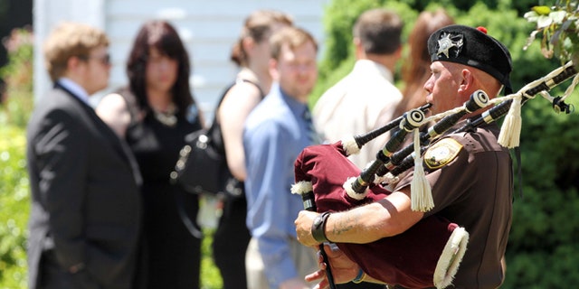 June 1, 2013: Family and friends arrive for a memorial service for Nancy Lanza in Kingston, N.H.  Lanzas 20-year-old son, Adam Lanza, killed her at their home in Newtown, Conn., on Dec. 14 and then drove to Sandy Hook Elementary School, where he killed the children and six school employees before committing suicide.