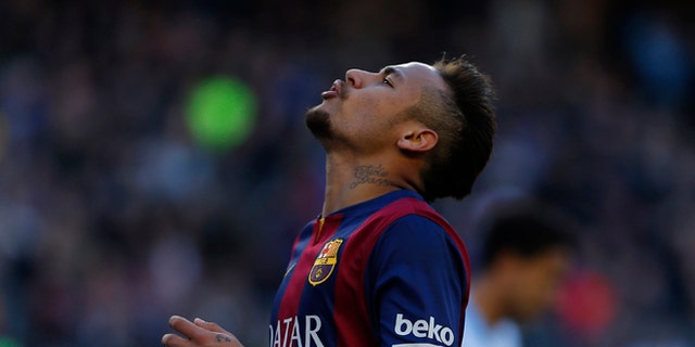 Barcelona's Neymar, from Brazil, reacts during a Spanish La Liga soccer match at the Camp Nou stadium in Barcelona, Spain, Saturday, Feb. 21, 2015. (AP Photo/Emilio Morenatti)
