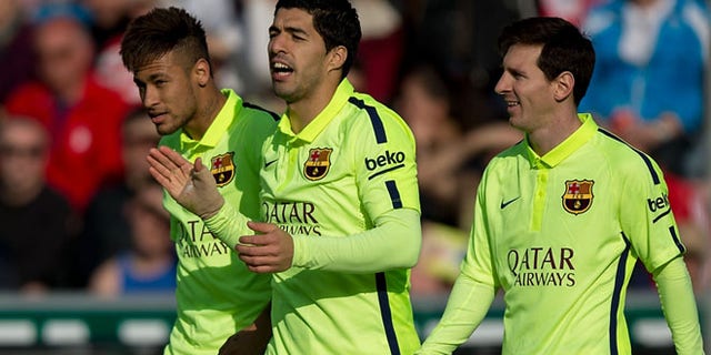 GRANADA, SPAIN - FEBRUARY 28: Luis Suarez (C) celebrates scoring their second goal with team mates Neymar JR. (L) and Lionel Messi (R) during the La Liga match between Granada CF and FC Barcelona at Nuevo Estadio de los Carmenes on February 28, 2015 in Granada, Spain. (Photo by Gonzalo Arroyo Moreno/Getty Images)
