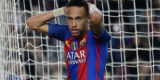 FILE - In this Saturday, Nov. 19, 2016 file photo, FC Barcelona's Neymar reacts during the Spanish La Liga soccer match between FC Barcelona and Malaga at the Camp Nou in Barcelona, Spain. Spanish prosecutors are seeking a two-year prison sentence and a $10.6 million fine for Neymar on corruption charges because of alleged irregularities during his transfer from Brazilian club Santos to Barcelona, it was reported on Wednesday, Nov. 23, 2016. (AP Photo/Manu Fernandez, File)