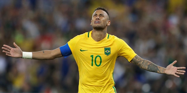 Brazil's Neymar celebrates after scoring the decisive penalty kick during the final match of the men's Olympic football tournament between Brazil and Germany at the Maracana stadium in Rio de Janeiro, Brazil, Saturday Aug. 20, 2016. Brazil won the gold medal on a penalty shootout. (AP Photo/Andre Penner)