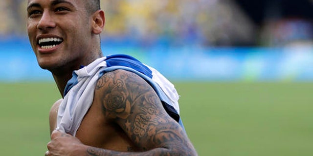 Brazil's Neymar smiles at the end of a semifinal match of the men's Olympic football tournament between Brazil and Honduras at the Maracana stadium in Rio de Janeiro Wednesday Aug. 17, 2016. Brazil won the match 6-0 and qualified for the final.(AP Photo/Felipe Dana)