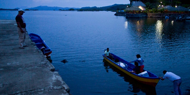 June 7, 2013: In this photo, people push a boat into Lake Nicaragua, near Granada, Nicaragua. A multi-billion dollar Chinese plan to plow a massive rival to the Panama Canal across the middle of Nicaragua was headed for approval by the leftist-controlled National Assembly Thursday, June 13, 2013, capping a lightning-fast approval process that has provoked deep skepticism among shipping experts and intense concern among environmentalists.