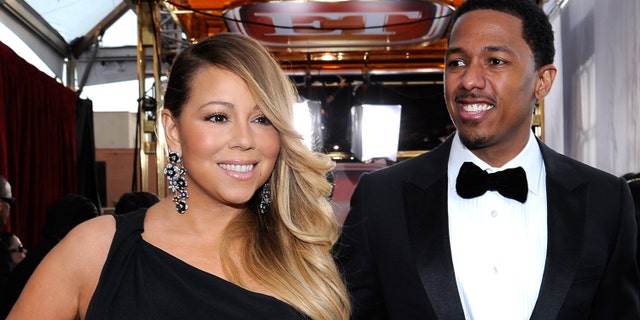 Singer-actress Mariah Carey and TV personality Nick Cannon attend the 20th Annual Screen Actors Guild Awards at The Shrine Auditorium on January 18, 2014 in Los Angeles, California.