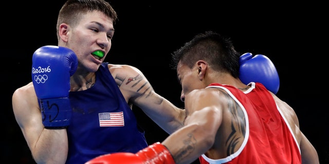 United States' Nico Miguel Hernandez, left, fights Ecuador's Carlos Eduardo Quipo Pilataxi on Aug. 10, 2016.