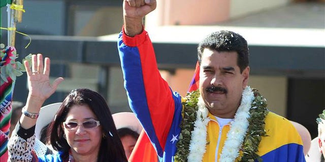 Venezuelan President Nicolas Maduro and his wife, Cilia Flores.