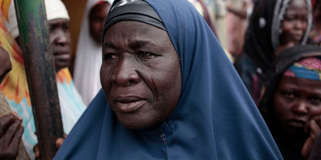 April 8, 2015 - A woman cries as she learns her relatives were killed by Boko Haram in Gwoza, Nigeria. An estimated 800,000 children have been forced from their homes by Boko Haram extremists, according to a UNICEF report. The number of refugee children has doubled in the past year in the Islamic uprising.