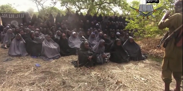 May 12, 2014 - Photo taken from video by Nigeria's Boko Haram terrorist network shows the alleged missing girls abducted from the northeastern town of Chibok. The new video purports to show the girls, covered in jihab and praying in Arabic. It is the first public sight of the girls since more than 300 were kidnapped exactly four weeks ago.