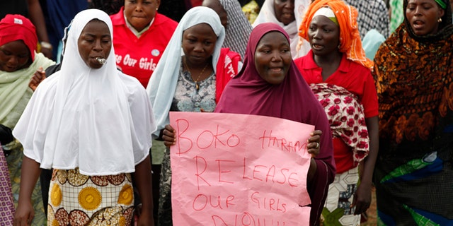 May 28, 2014: Women sing slogans during a demonstration calling on the government to rescue the kidnapped girls of the government secondary school in Chibok, in Abuja, Nigeria. (AP)