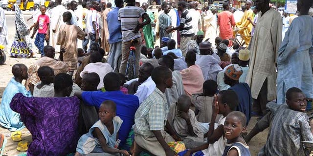 Sept. 3, 2014: Civilians who fled their homes following an attacked by Islamist militants in Bama, take refuge at a School in Maiduguri, Nigeria. (AP)