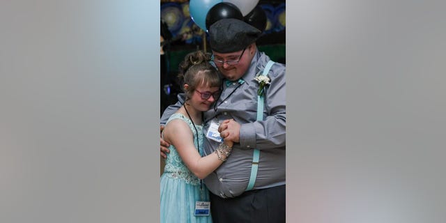 Two VIPs dance together at a "Night to Shine" from February 10, 2017.